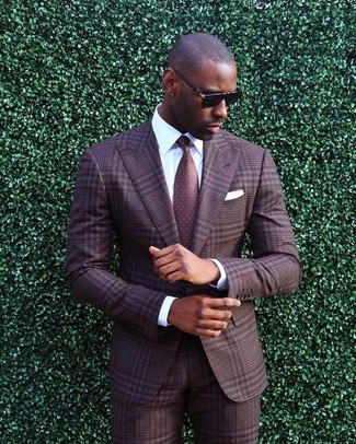 Burgundy Polka Dot Tie Outfits For Men: Try pairing a brown plaid suit with a burgundy polka dot tie to look clean and sharp.