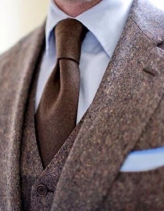Dark Brown Three Piece Suit Outfits: Make a fashionable statement anywhere you go by wearing a dark brown three piece suit and a light blue dress shirt.