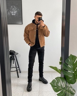 Black Leather Work Boots Outfits For Men: If you're on the lookout for a casual yet seriously stylish ensemble, rock a brown varsity jacket with black jeans. With footwear, go for something on the casual end of the spectrum by finishing with a pair of black leather work boots.