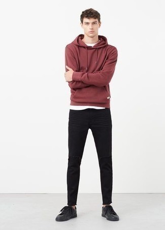 Red Hoodie Outfits For Men: The perfect choice for casual menswear style? A red hoodie with black ripped jeans. Complete this look with black leather low top sneakers to easily bump up the fashion factor of any ensemble.