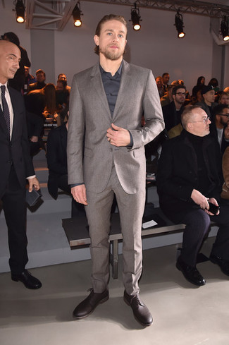 Charlie Hunnam wearing Burgundy Leather Derby Shoes, Charcoal Dress Shirt, Grey Wool Suit