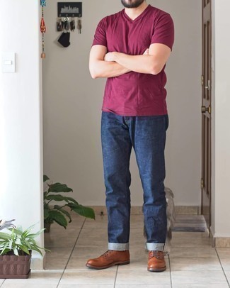 Red V-neck T-shirt Outfits For Men: A red v-neck t-shirt and navy jeans have become veritable wardrobe staples for most gents. For footwear, take the classic route with a pair of tobacco leather casual boots.