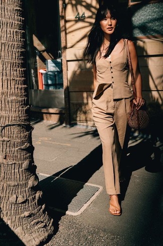 Tan Leather Heeled Sandals Outfits: This combo of a tan bustier top and khaki dress pants is incredibly chic and yet it's casual and apt for anything. When not sure as to what to wear in the shoe department, introduce tan leather heeled sandals to the mix.