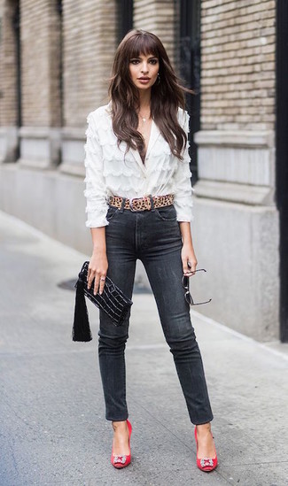 Black Skinny Jeans Outfits: Showcase your outfit coordination expertise by opting for this off-duty combination of a white lace button down blouse and black skinny jeans. Complete your look with a pair of red embellished satin pumps for maximum effect.