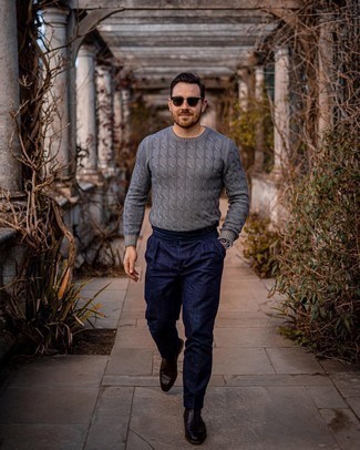 Charcoal Cable Sweater Outfits For Men: This combo of a charcoal cable sweater and navy linen chinos is a good look for off duty. A pair of dark brown leather chelsea boots will class up this outfit.