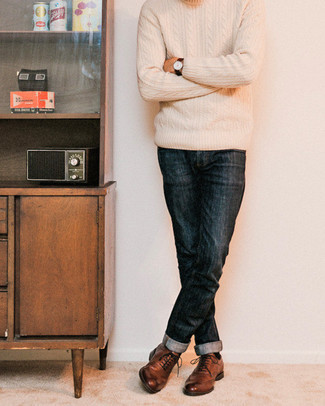 Beige Cable Sweater Outfits For Men: A beige cable sweater and navy jeans are a good combo worth incorporating into your casual arsenal. Feeling brave? Switch up your ensemble by wearing brown leather brogues.