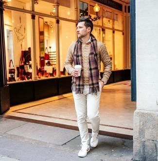 Scarf Outfits For Men: For a relaxed ensemble with a modern spin, try teaming a tan cable sweater with a scarf. If you need to immediately class up this look with one item, add white print leather low top sneakers to the mix.
