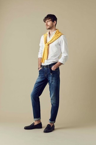 Yellow Cable Sweater Outfits For Men: Extremely stylish and comfortable, this casual combo of a yellow cable sweater and navy jeans provides variety. To introduce an extra dimension to your ensemble, complement your outfit with black leather loafers.