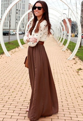 Brown Pleated Maxi Skirt Outfits: The styling capabilities of a white and black polka dot cable sweater and a brown pleated maxi skirt guarantee you'll always have them on constant rotation in your wardrobe.