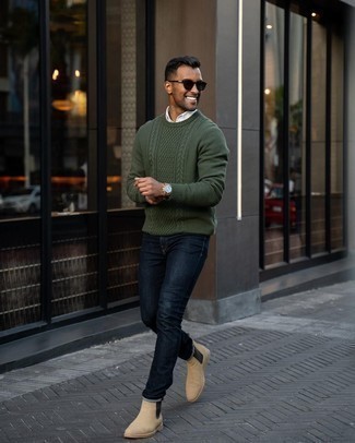 Dark Green Cable Sweater Outfits For Men: A dark green cable sweater and navy jeans teamed together are the ideal getup for those dressers who prefer relaxed casual styles. As for the shoes, you could take a more classic route with a pair of beige suede chelsea boots.