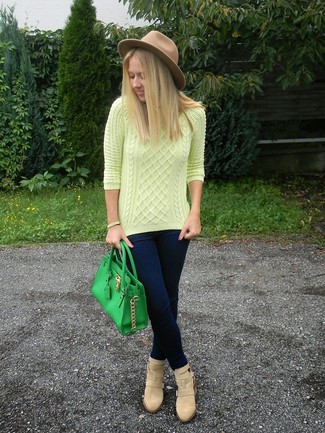 Tan Suede Ankle Boots Outfits: This combination of a yellow cable sweater and navy skinny jeans is proof that a safe casual ensemble doesn't have to be boring. For something more on the dressier end to complete your ensemble, complement this ensemble with a pair of tan suede ankle boots.