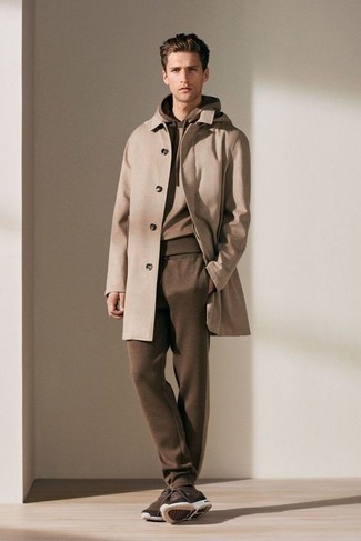 Camel Overcoat Warm Weather Outfits: A camel overcoat and a brown track suit are a combo that every sharp man should have in his casual repertoire. Dark brown athletic shoes will bring a more casual finish to an otherwise mostly dressed-up look.