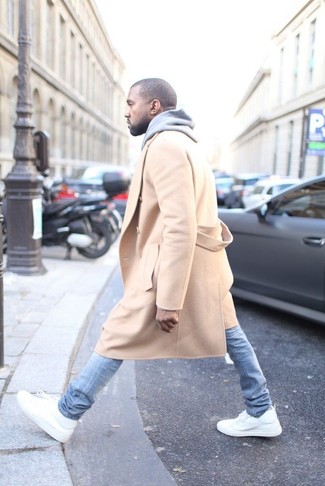 Kanye West wearing Camel Overcoat, Grey Hoodie, Light Blue Skinny Jeans, White Leather High Top Sneakers