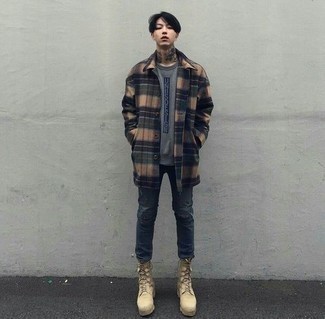 500+ Chill Weather Outfits For Men: Pair a camel plaid overcoat with charcoal ripped skinny jeans for an off-duty outfit. A trendy pair of beige suede work boots is an effortless way to bring an air of stylish casualness to this outfit.