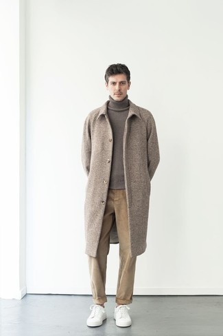 Camel Herringbone Overcoat Outfits: A camel herringbone overcoat and khaki corduroy chinos are absolute must-haves if you're putting together a semi-casual wardrobe that matches up to the highest menswear standards. Go the extra mile and change up your getup with white canvas low top sneakers.