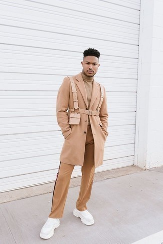 Beige Turtleneck Outfits For Men: Effortlessly blurring the line between cool and relaxed, this combination of a beige turtleneck and khaki chinos will easily become one of your favorites. Bring an air of stylish casualness to by rounding off with white athletic shoes.