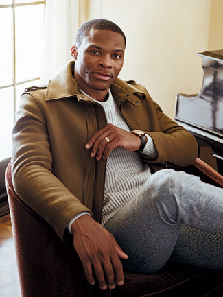 Russell Westbrook wearing Camel Overcoat, White Cable Sweater, Grey Plaid Wool Dress Pants, Dark Brown Leather Watch