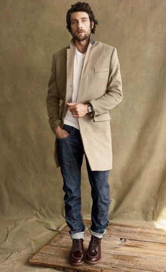 Brown Leather Work Boots Outfits For Men: You're looking at the indisputable proof that a camel overcoat and navy jeans are awesome when teamed together. Got bored with this look? Let brown leather work boots mix things up.