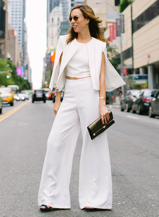 Cape Blazer Outfits: A cape blazer and white wide leg pants? Make no mistake, this look will turn every head around. When it comes to footwear, introduce black leather heeled sandals to the mix.