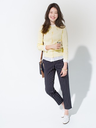 Oxford Shoes Outfits For Women: If you feel more confident in comfy clothes, you'll love this incredibly chic combination of a yellow cardigan and navy vertical striped tapered pants. Complement your outfit with oxford shoes to tie the whole thing together.