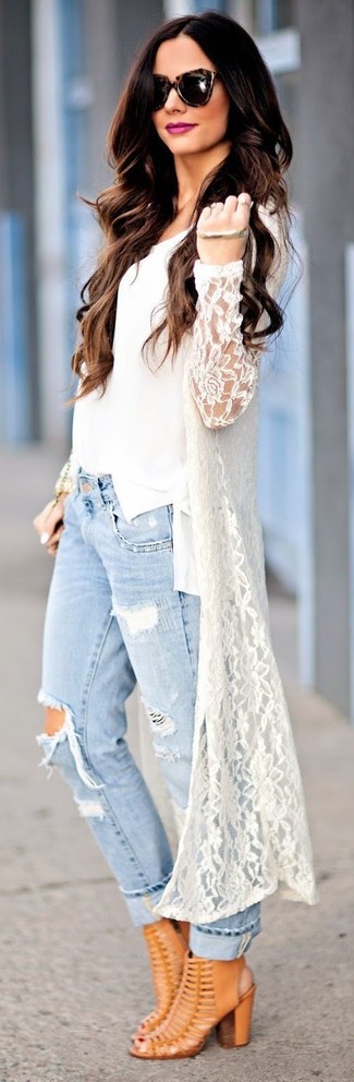 Tobacco Leather Ankle Boots Outfits: This combo of a white lace cardigan and light blue ripped boyfriend jeans is on the casual side but also ensures that you look chic and totally cool. Let's make a bit more effort with footwear and complete this look with a pair of tobacco leather ankle boots.