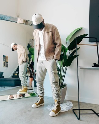 High Top Sneakers Outfits For Men: Opt for a tan cardigan and grey cargo pants if you want to look casually cool without exerting much effort. Grab a pair of high top sneakers to add an element of stylish casualness to your look.