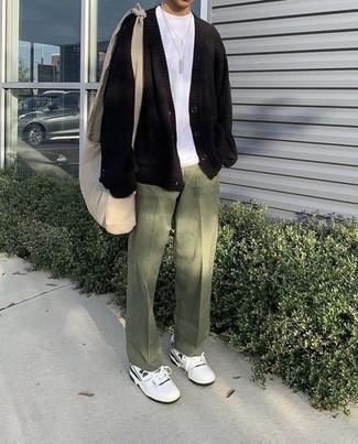 White and Green Leather Low Top Sneakers Outfits For Men: Dress in a black cardigan and olive chinos if you want to look laid-back and cool without trying too hard. Put a more relaxed spin on this getup by rocking white and green leather low top sneakers.