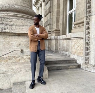 Tan Cardigan Outfits For Men: This combination of a tan cardigan and navy chinos is hard proof that a pared down casual outfit doesn't have to be boring. Why not complement your look with black chunky leather derby shoes for an added touch of style?