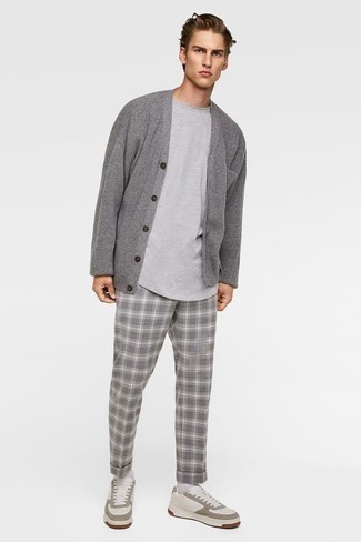 White Leather Low Top Sneakers Outfits For Men: A grey cardigan and grey plaid chinos are a combo that every dapper gent should have in his menswear arsenal. Finishing with white leather low top sneakers is the most effective way to infuse a more casual touch into this outfit.