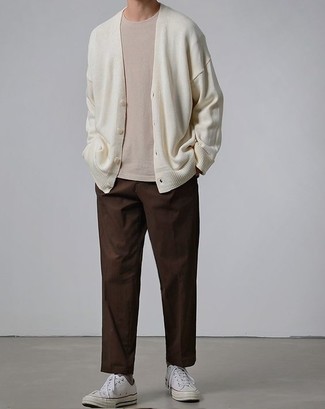 Dark Brown Chinos Outfits: Go for a white cardigan and dark brown chinos for comfort dressing with a contemporary spin. On the shoe front, go for something on the laid-back end of the spectrum by sporting a pair of white canvas low top sneakers.