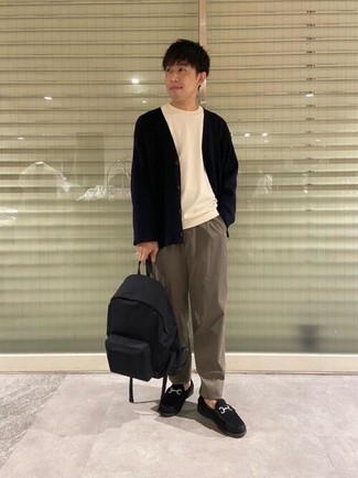 Black Canvas Backpack Outfits For Men: Try teaming a navy cardigan with a black canvas backpack for a casual look with a modern twist. Infuse an added touch of sophistication into your outfit by finishing with black suede loafers.
