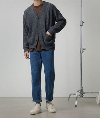 Charcoal Cardigan Outfits For Men: This relaxed combination of a charcoal cardigan and navy jeans is super easy to throw together in seconds time, helping you look amazing and ready for anything without spending too much time searching through your wardrobe. Complement this outfit with white canvas low top sneakers to make an all-too-safe outfit feel suddenly fresh.