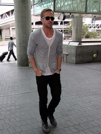 Ryan Gosling wearing White and Black Horizontal Striped Cardigan, Grey Crew-neck T-shirt, Black Jeans, Black Leather Casual Boots