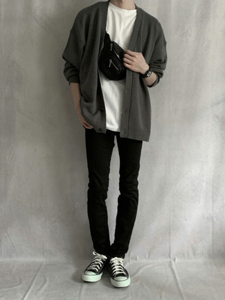 Black and White Canvas Low Top Sneakers Outfits For Men: Combining a charcoal cardigan with black jeans is an on-point option for a laid-back outfit. For something more on the relaxed side to complement your outfit, complement this getup with black and white canvas low top sneakers.
