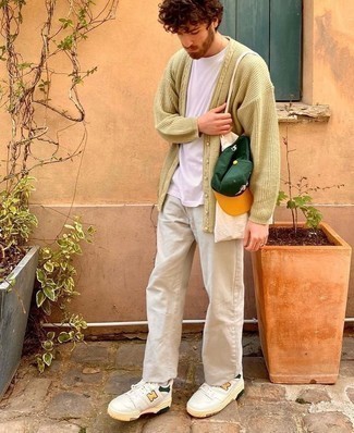 Olive Print Baseball Cap Outfits For Men: The styling capabilities of a beige cardigan and an olive print baseball cap ensure they will stay on constant rotation in your wardrobe. To give your look a sleeker finish, introduce white leather low top sneakers to your ensemble.