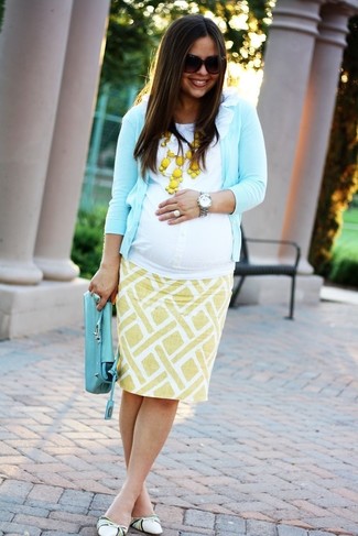Aquamarine Cardigan Outfits For Women: Loving how this combo of an aquamarine cardigan and a yellow print pencil skirt immediately makes people look absolutely stylish. You could perhaps get a little creative on the shoe front and dress down this look by slipping into a pair of white leather ballerina shoes.