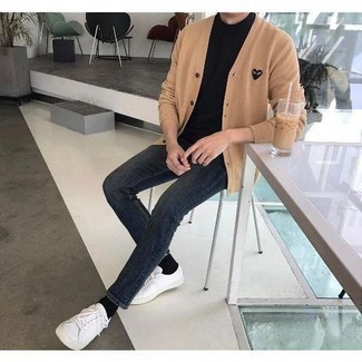 White Low Top Sneakers Outfits For Men: For a casually cool getup, wear a tan cardigan and charcoal skinny jeans — these items work really well together. White low top sneakers are a winning footwear option that's full of personality.