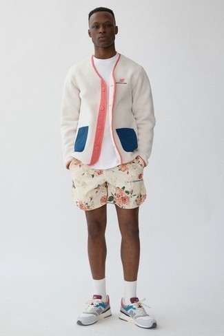 500+ Relaxed Warm Weather Outfits For Men: For a look that's pared-down but can be modified in a ton of different ways, reach for a white fleece cardigan and white floral sports shorts. Introduce a pair of grey athletic shoes to the mix to keep the ensemble fresh.