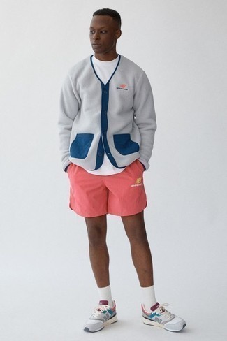 500+ Relaxed Warm Weather Outfits For Men: A grey fleece cardigan and hot pink sports shorts paired together are the ideal combination for guys who love cool and relaxed styles. Serve a little mix-and-match magic by slipping into grey athletic shoes.