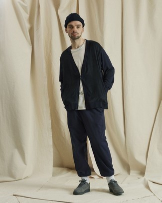 Charcoal Canvas Low Top Sneakers Outfits For Men: This combo of a navy cardigan and navy sweatpants is hard proof that a straightforward casual look can still be extra dapper. If you're clueless about how to round off, introduce a pair of charcoal canvas low top sneakers to the equation.