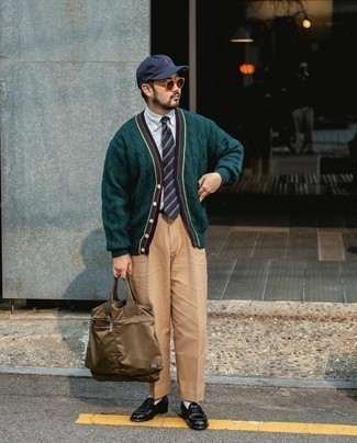 Brown Canvas Tote Bag Outfits For Men: This street style combination of a dark green knit cardigan and a brown canvas tote bag is super versatile and apt for whatever the day throws at you. And if you want to easily class up your outfit with one single item, why not complement your getup with a pair of black leather loafers?