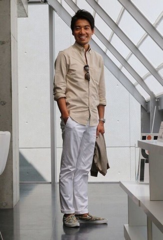 Beige Cardigan Outfits For Men: A beige cardigan and white chinos are an easy way to infuse extra cool into your daily casual repertoire. Multi colored print canvas slip-on sneakers tie the outfit together.