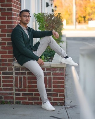 Olive Cardigan Casual Outfits For Men: An olive cardigan and grey jeans are the kind of casual staples that you can wear for years to come. Complete this look with a pair of white leather low top sneakers to instantly rev up the fashion factor of this getup.