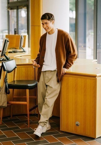 Tobacco Cardigan Outfits For Men: This combo of a tobacco cardigan and khaki chinos is on the off-duty side but also ensures that you look stylish and incredibly stylish. White canvas low top sneakers will add a more laid-back feel to an otherwise mostly classic outfit.