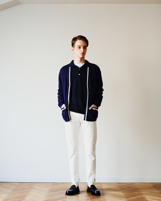 Navy Cardigan Outfits For Men: Uber stylish and comfortable, this casual combo of a navy cardigan and white chinos provides with amazing styling opportunities. For something more on the smart end to complement this look, add black leather loafers to the mix.