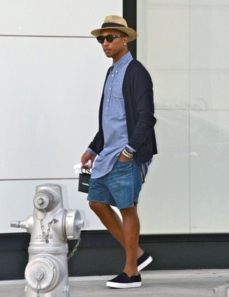 Pharrell Williams wearing Black Cardigan, Blue Chambray Polo, Blue Denim Shorts, Black Slip-on Sneakers
