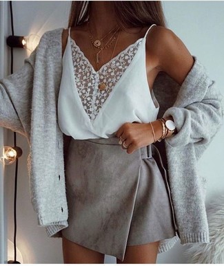 Grey Suede Mini Skirt Outfits: Choose a grey cardigan and a grey suede mini skirt to achieve an incredibly chic and modern-looking off-duty ensemble.