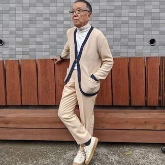 Beige Cardigan Outfits For Men: A beige cardigan and beige dress pants are absolute essentials if you're picking out a polished wardrobe that holds to the highest sartorial standards. Balance your look with more casual footwear, such as these white canvas low top sneakers.