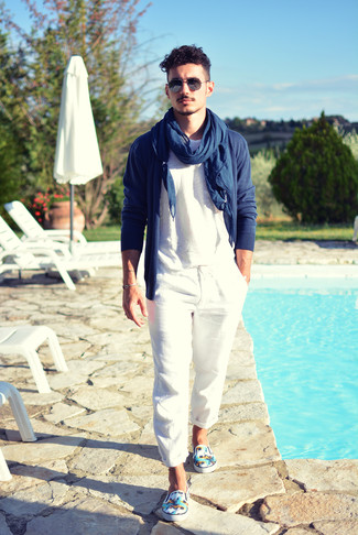 Navy Scarf Outfits For Men: This off-duty combination of a navy cardigan and a navy scarf is clean, stylish and extremely easy to copy. Feel uninspired with this getup? Invite white print canvas slip-on sneakers to jazz things up.