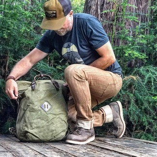 Men's Olive Canvas Backpack, Dark Brown Leather Casual Boots, Brown Chinos, Navy Print Crew-neck T-shirt